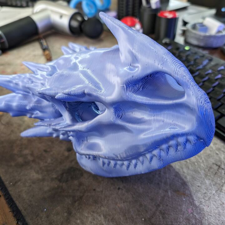Lavender dragon skull with horns and rows of teeth