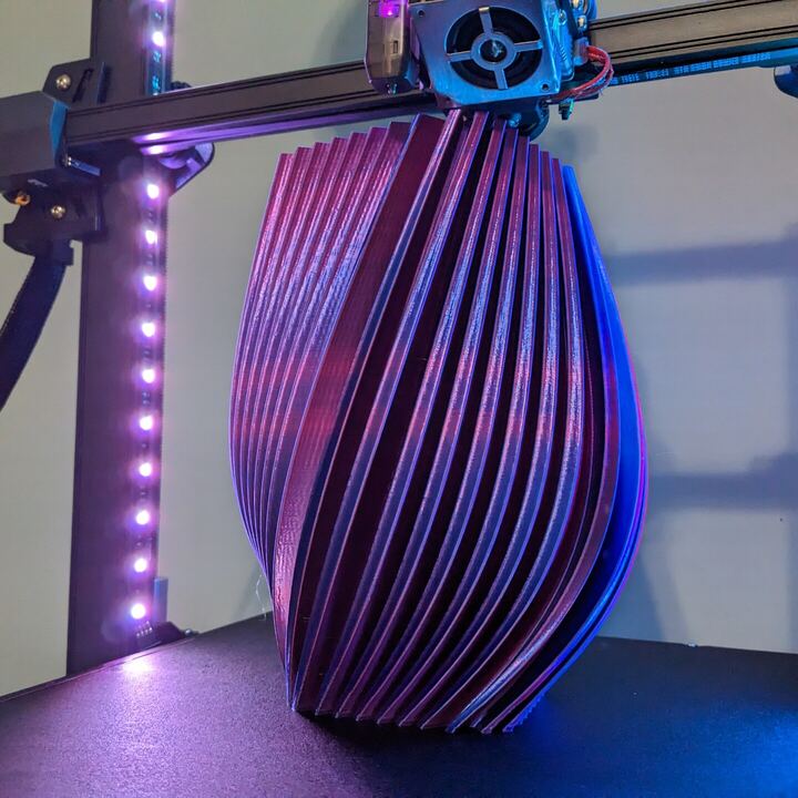 Purple spiral vase finishing on the 3D printer bed